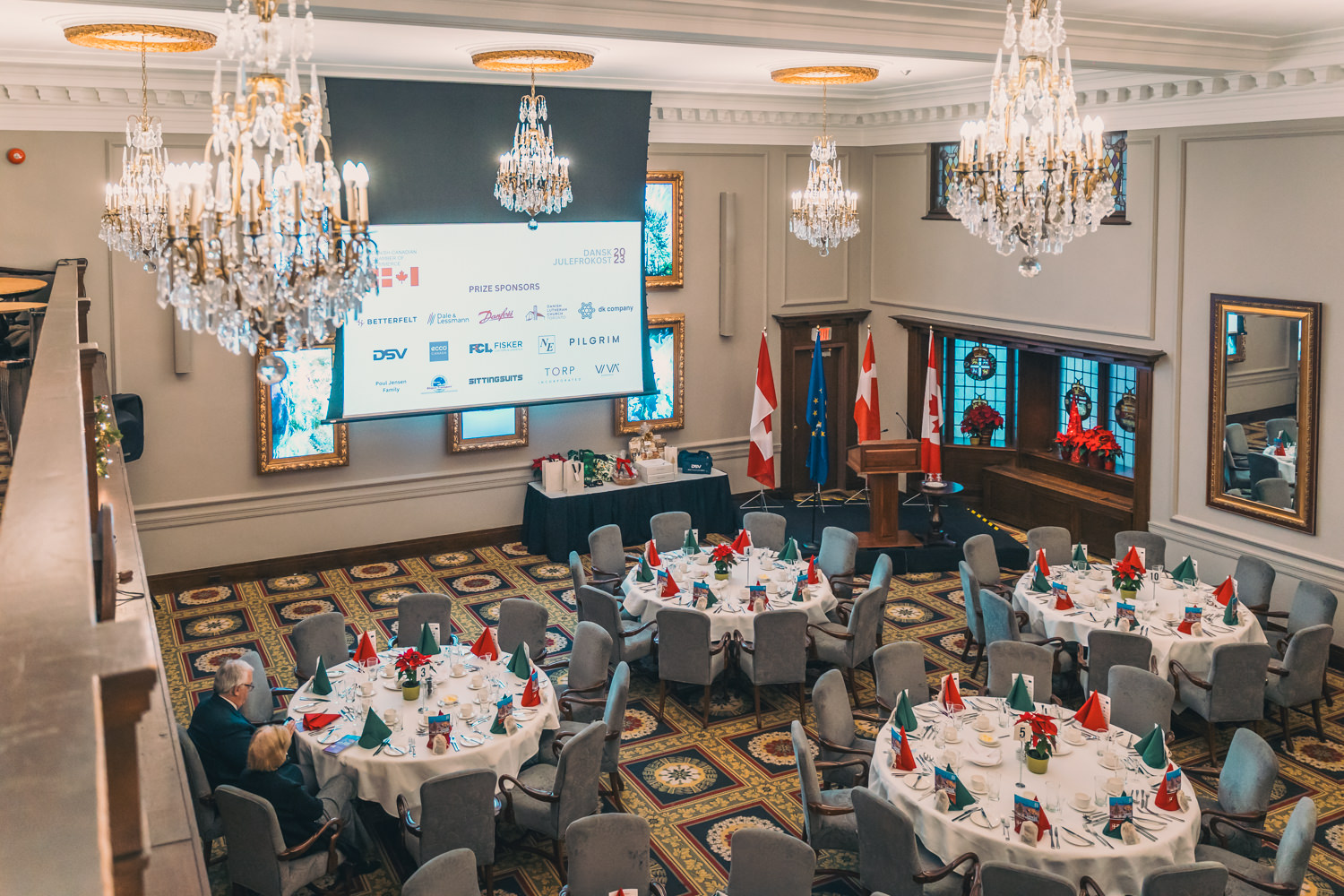 Danish-Canadian Chamber dinner venue setup with chandeliers